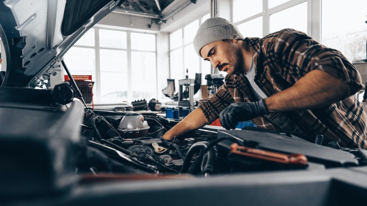 Mechanic inspecting a car in Clayton