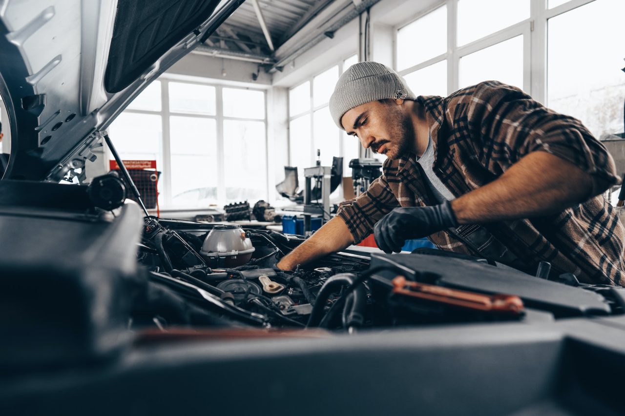 Mechanic Examining Car and Repair Service Center In Clayton